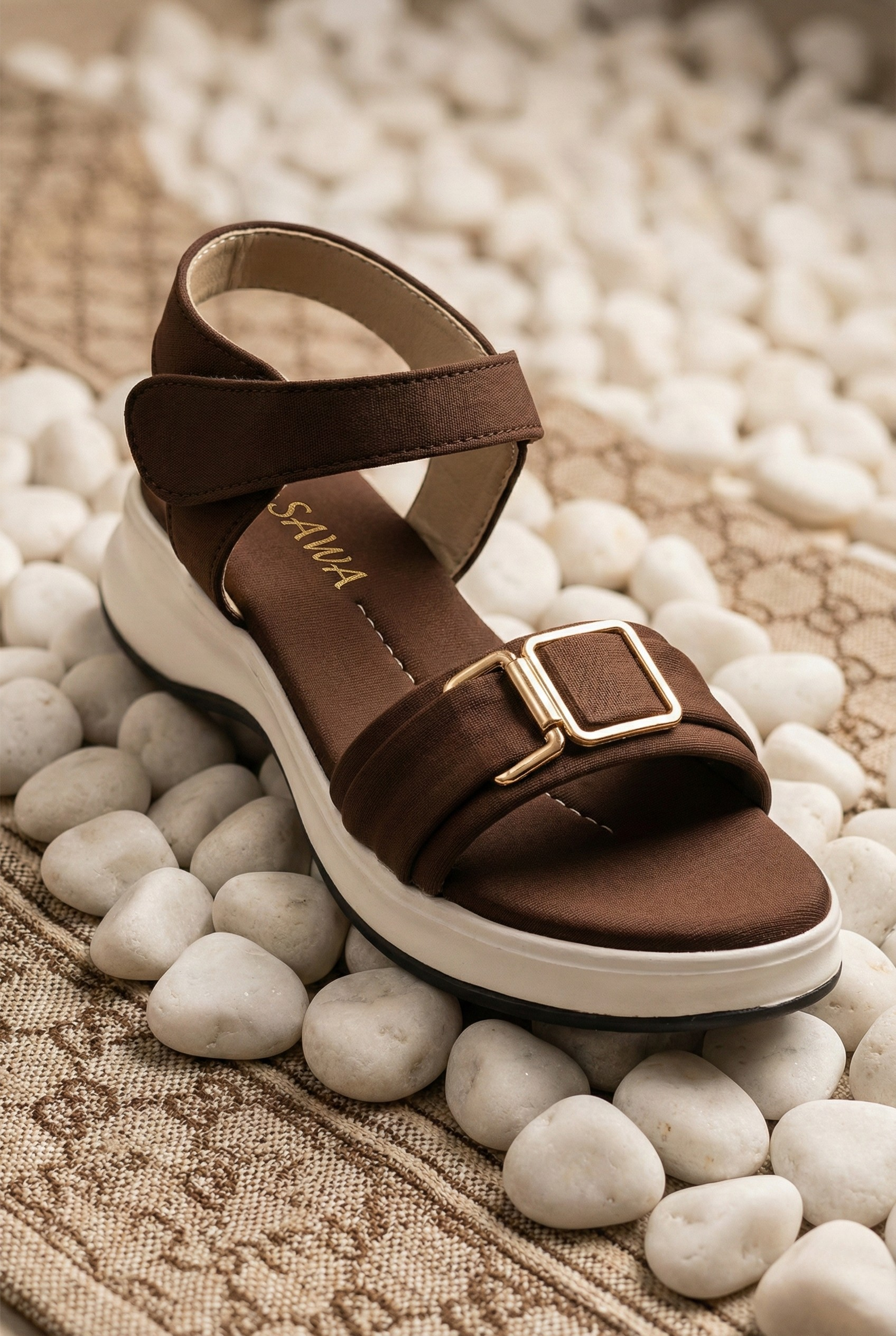 Brown sandal with white sole