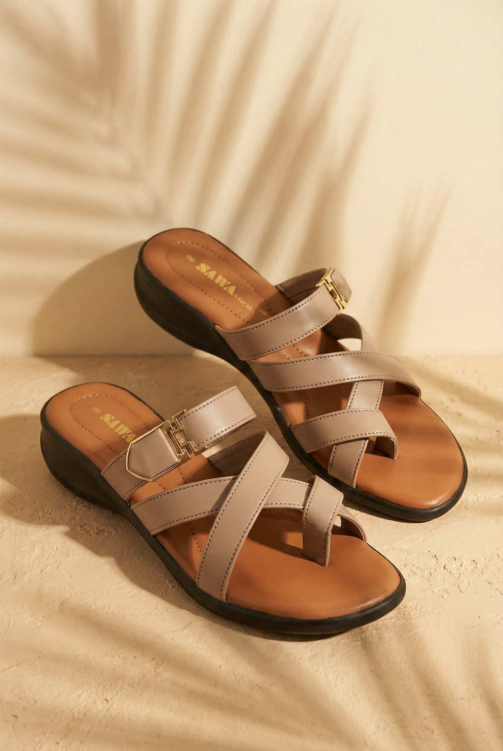 Pair of beige sandals with multiple straps 