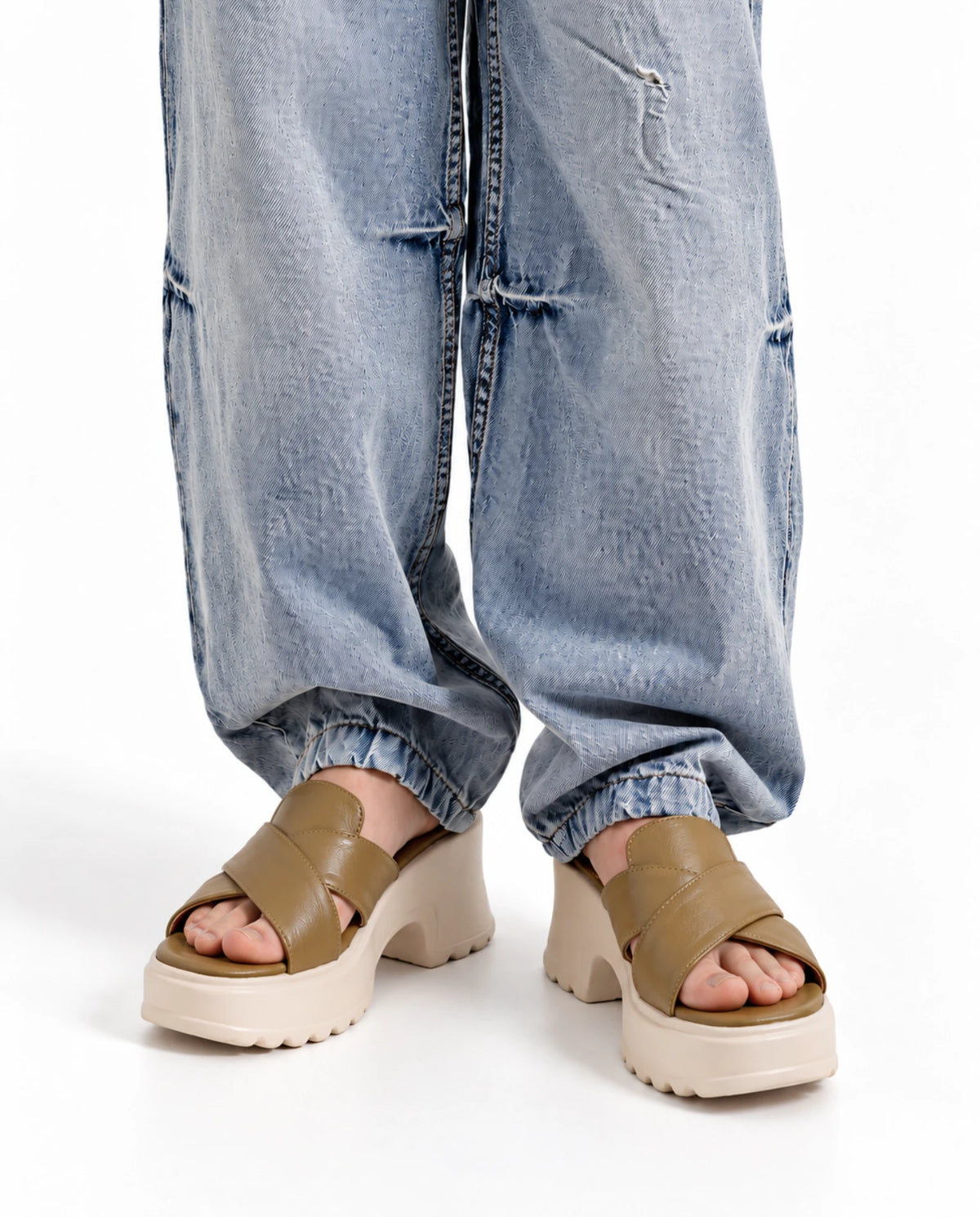 Olive comfort platform heels styled with wide-leg jeans