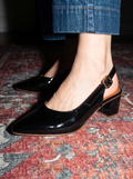 Black patent slingback block heels with pointed toe and adjustable strap by SAWA Shoes