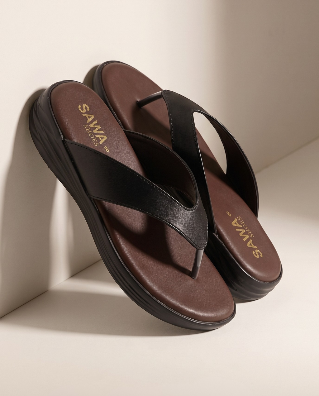 Black thong sandals for women with cushioned brown footbed and comfortable everyday sole
