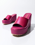 Fuchsia pink women’s platform wedge heels with a glossy wide strap, cushioned footbed and supportive slip-on design