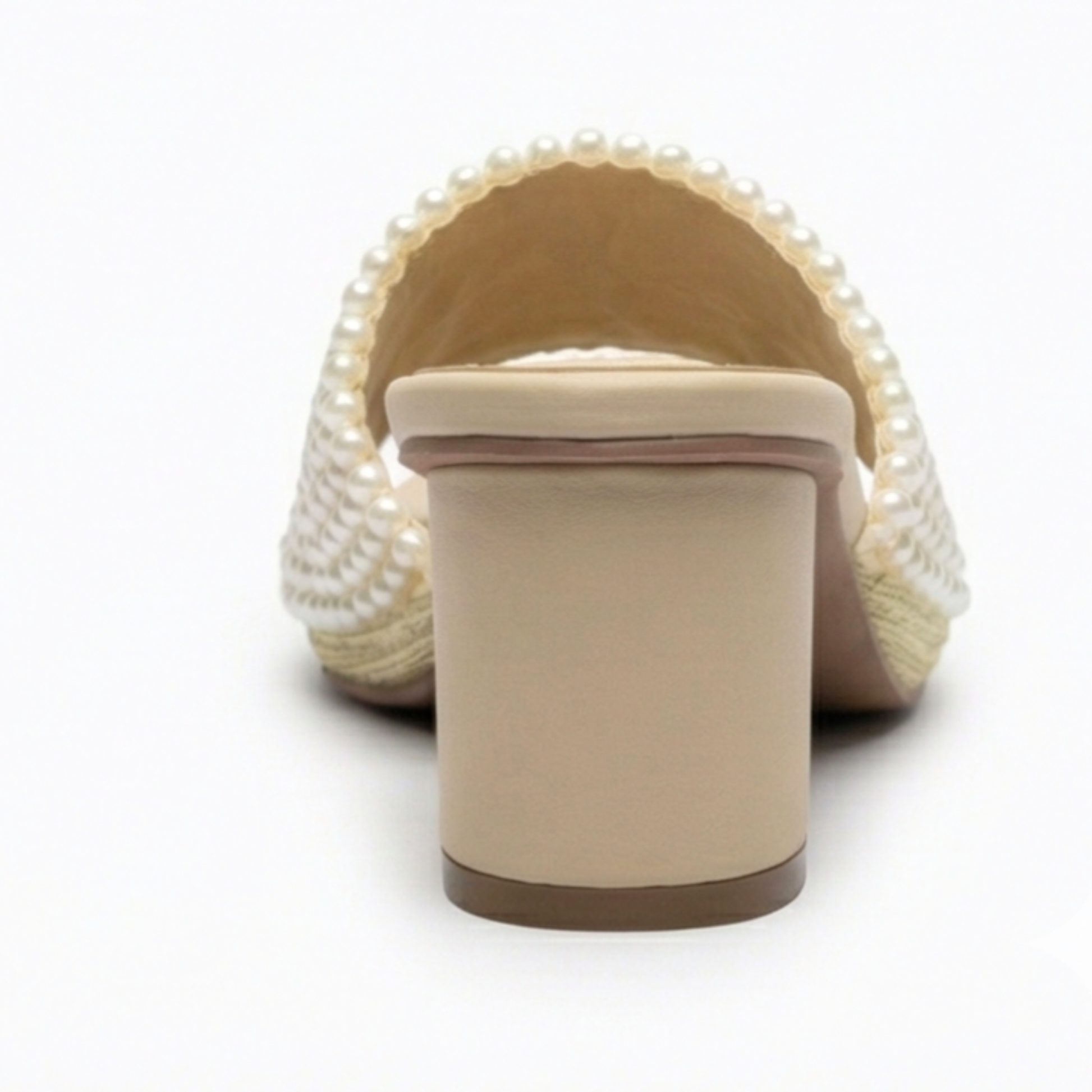 Side view of Aria pearl statement heels showing the beige cylindrical block heel and pearl-beaded strap