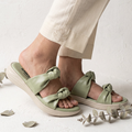 Sage green knotted women’s slides with padded footbed and lightweight cream platform sole by Sawa Shoes.