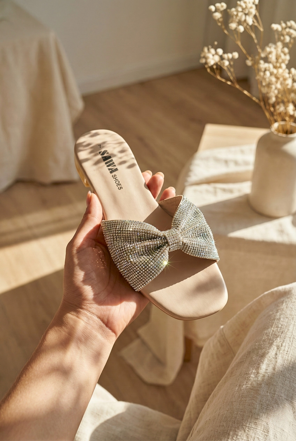 SAWA silver crystal bow flat sandals on feet, fancy stone work slides for ladies in Pakistan, ideal for wedding and party wear