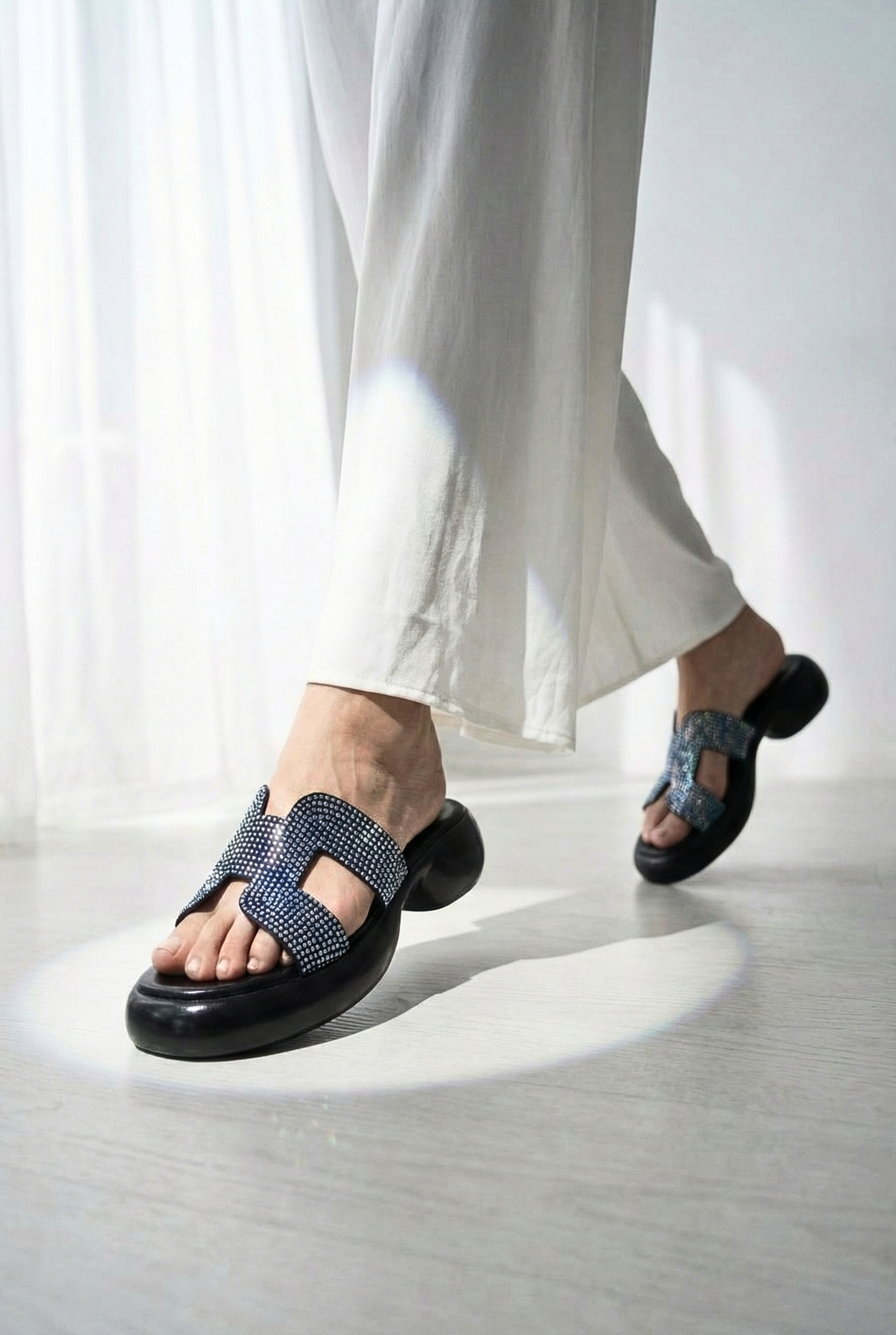Women’s rhinestone platform sandals paired with white linen trousers – trendy summer footwear Pakistan