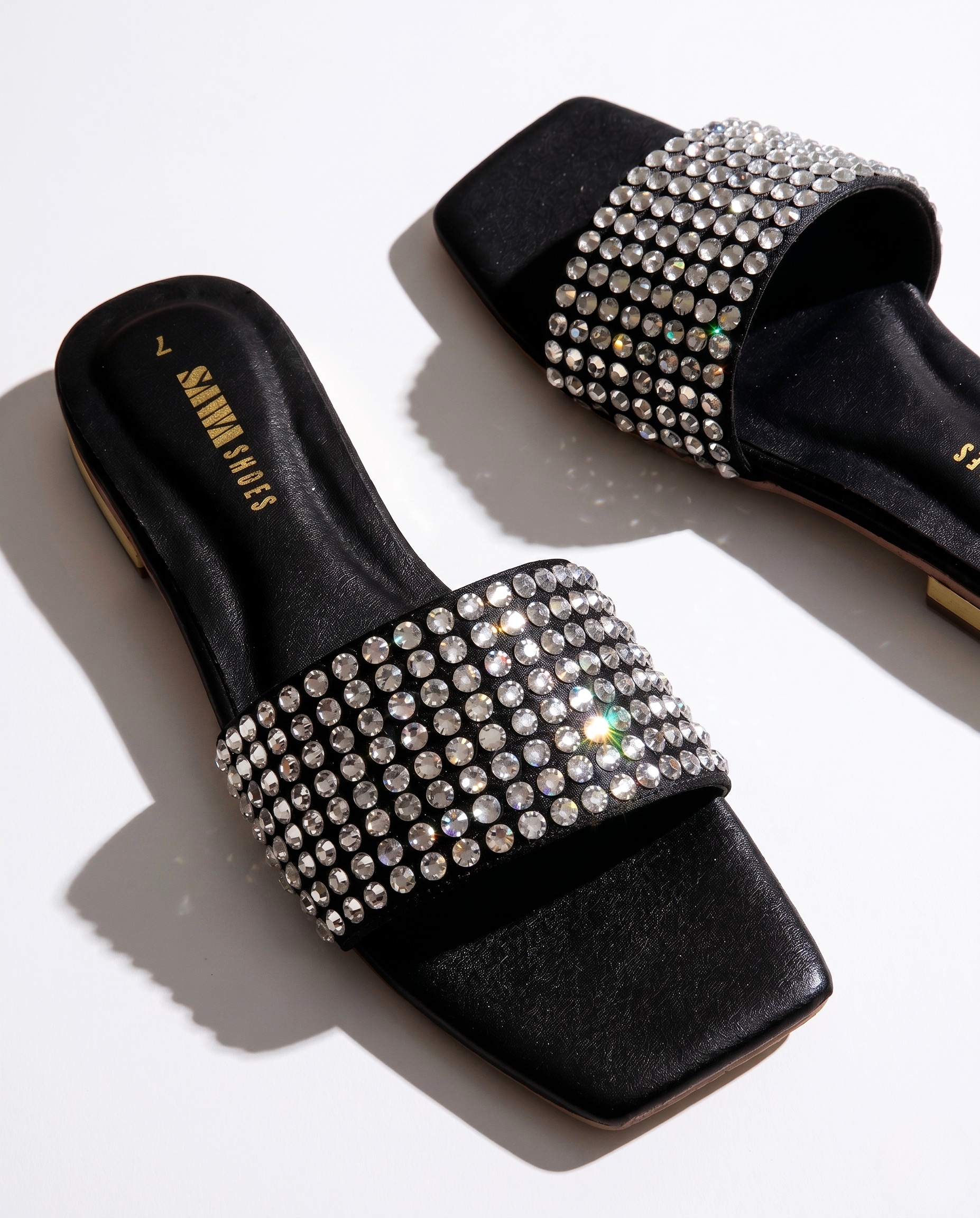 Black slides with rhinestone embellishments for women