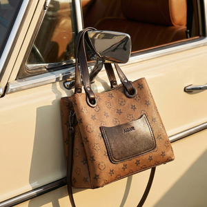 Vintage tan monogram tote bag with 11-inch width and 9-inch height dimensions displayed