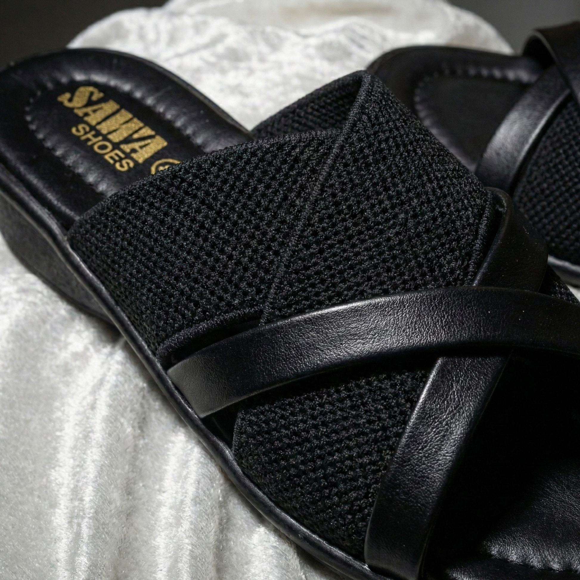 Close-up of the flexible, slip-resistant wedge sole and cushioned footbed of the SAWA Soft-Step sandal.
