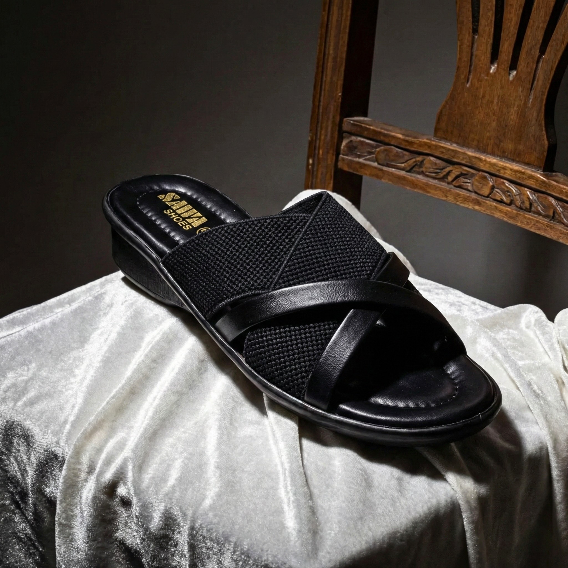 Pair of SAWA black slip-on mules for women, showcasing the stylish hybrid material and ergonomic design