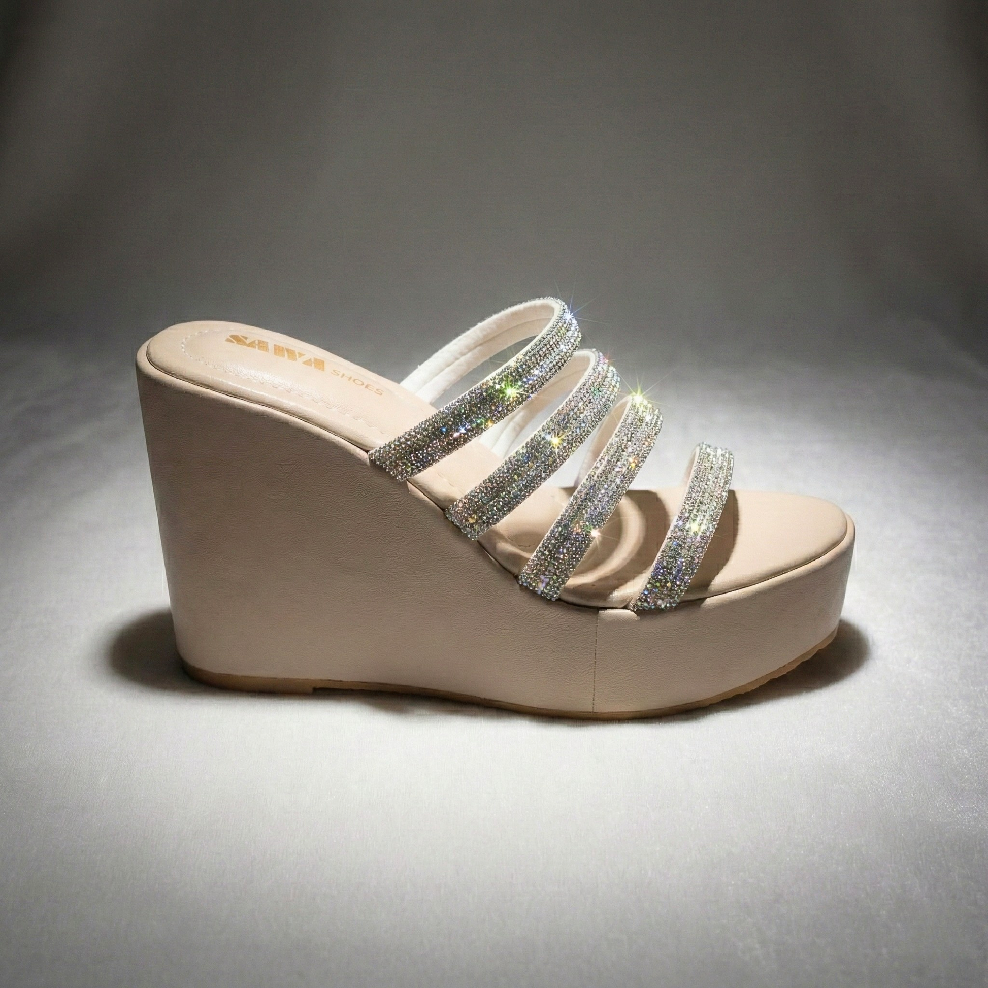 Silver platform wedges with rhinestone straps for Pakistani weddings.