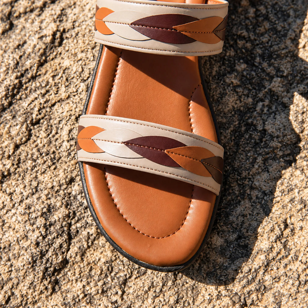 Close-up of leaf braid strap stitching in beige, tan and maroon