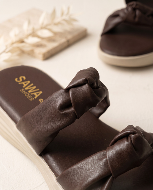 Dark brown women’s knotted slide sandals with cushioned footbed and lightweight cream platform sole by Sawa Shoes