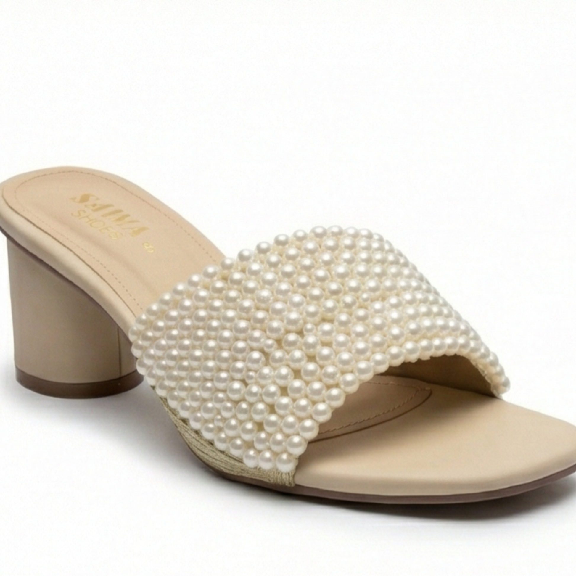 Nude block heel mules with a wide strap fully covered in white pearls and gold trim