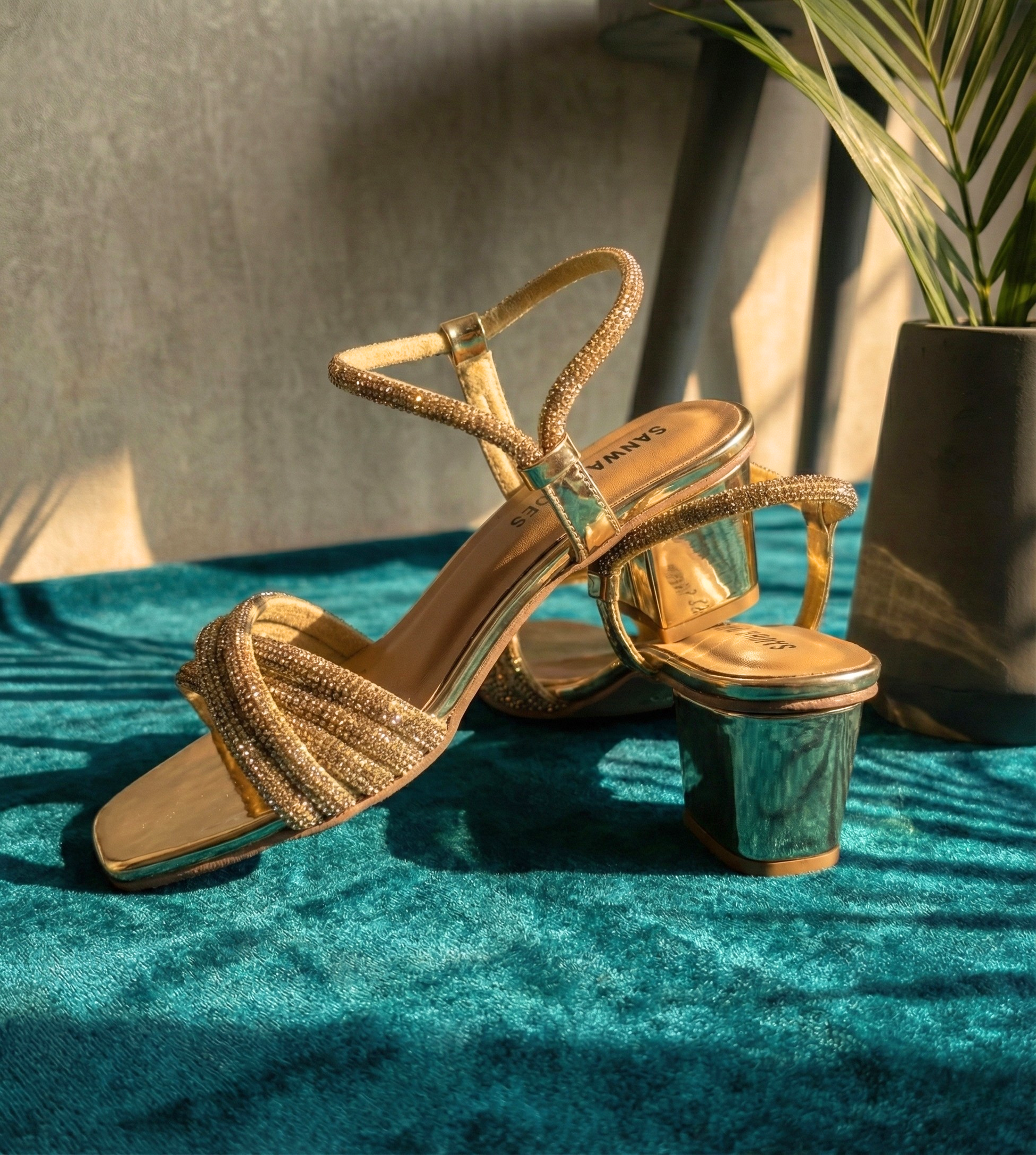 Side view of women’s gold block heels with a 1-inch mirror finish heel and shimmering multi-strap design, luxury party wear footwear by sawa.pk