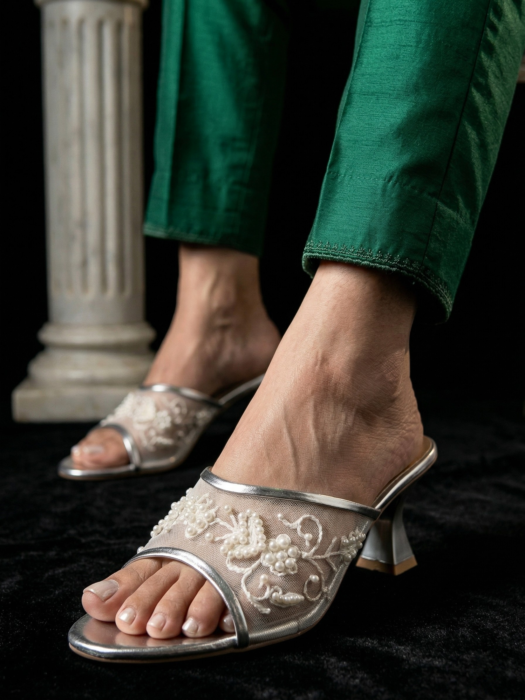Model wearing silver pearl embroidered mesh heels with traditional Pakistani formal trousers.