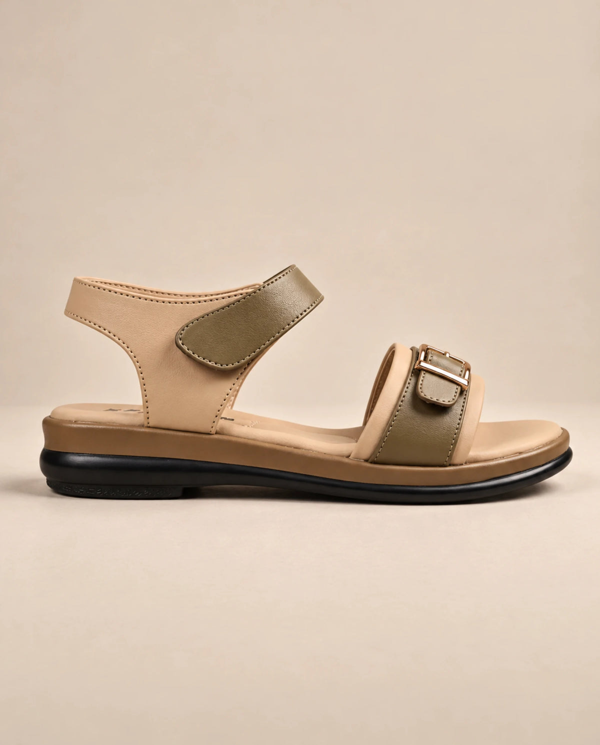 Side view of beige and olive buckle sandal with adjustable ankle strap